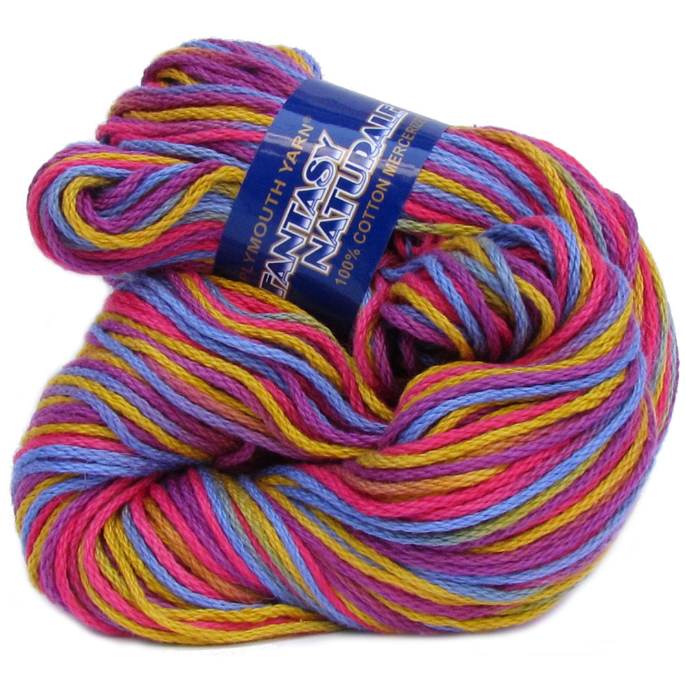 Multicolored skein of cotton fantasy naturale yarn with a label on a white background