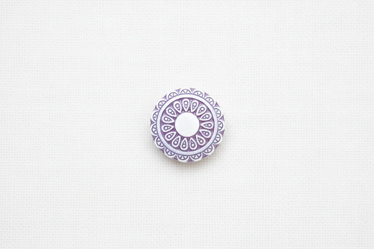 Decorative purple circular design on a white background