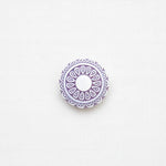 Decorative purple circular design on a white background