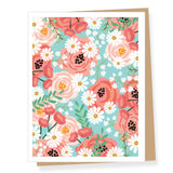 Floral patterned card with pink flowers and white daisies on a blue background