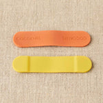 An orange and Yellow silicon magnetic clip