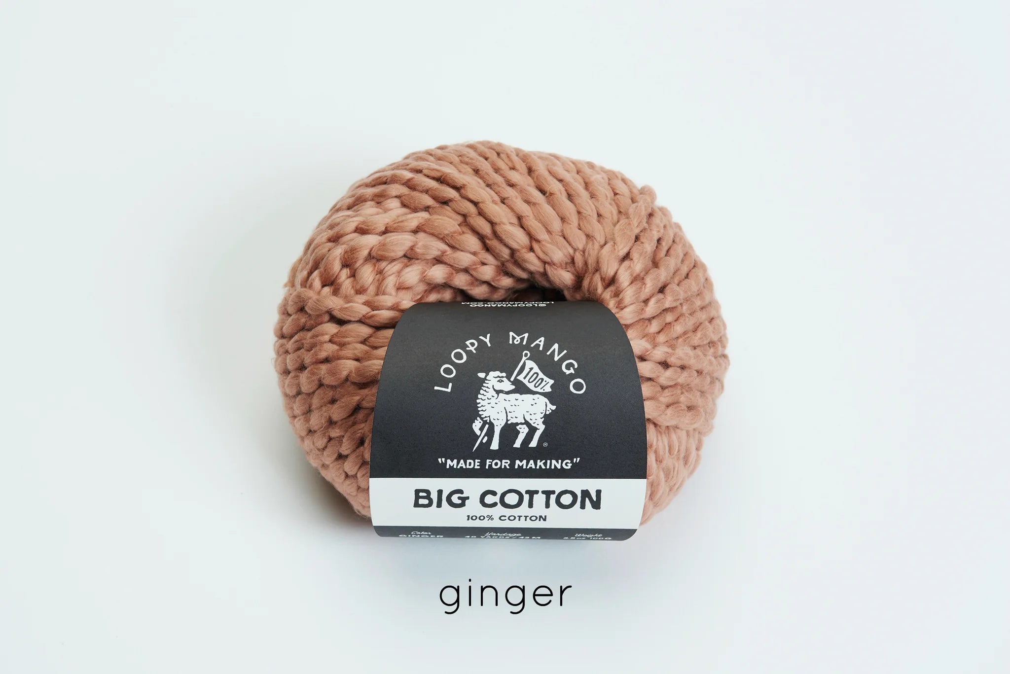 Ball of ginger colored yarn with Loopy Mango label on a white background