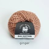 Ball of ginger colored yarn with Loopy Mango label on a white background