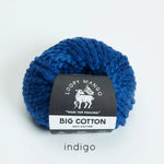 Blue skein of yarn with Loopy Mango label on a white background