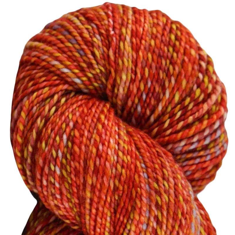 A skein of multicolored yarn with a marled pattern, featuring shades of red, orange, and green.