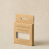 Cocoknits notions dish packaging on a beige background