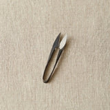 Yarn Snips on a beige textured background