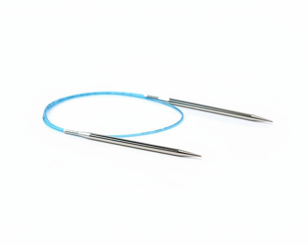 Pair of metal knitting needles with a blue circular needle on a white background
