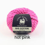 Pink yarn ball with Loopy Mango label on a white background