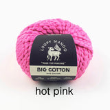 Pink yarn ball with Loopy Mango label on a white background