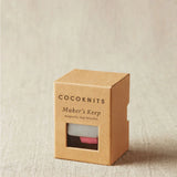 The packaged magnetic slap bracelet for holding notions.